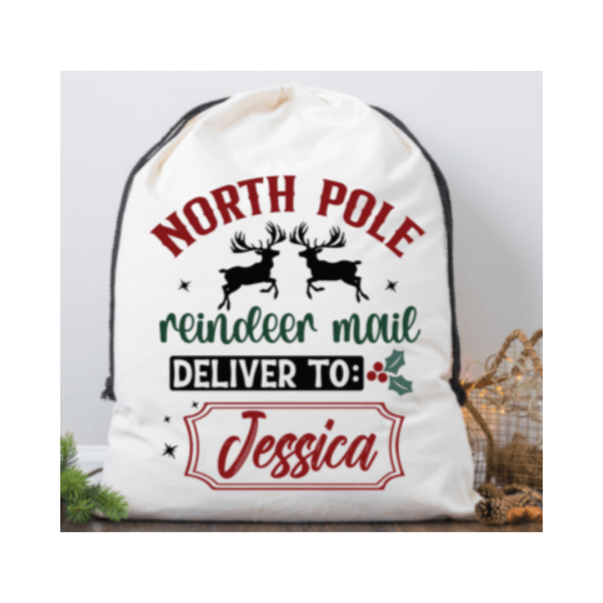 White drawstring bag with Christmas-themed text and reindeer design on a light gray background.